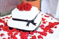 Wedding cake with red roses Royalty Free Stock Photo