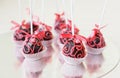 Wedding Cake On A Stick With Pink Ornament.