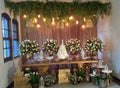 Wedding cake table with sweets and beautiful decor for the couple's party