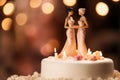 Wedding cake topper with two brides, figurines of a lesbian couple. Gay marriage concept. Lesbian couple wedding day, same-sex gay Royalty Free Stock Photo