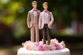 Wedding cake topper with two grooms, figurines of a gay couple. Gay marriage concept. Same-sex gay marriage, wedding sweets and