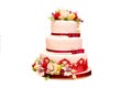 Wedding cake in white-red color with flowers Royalty Free Stock Photo