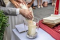 The wedding candle in the hands of the bride and groom. candle is the family hearth symbol at a wedding Royalty Free Stock Photo