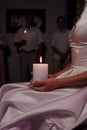 The wedding candle in the hands of the bride and groom Royalty Free Stock Photo