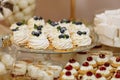 Wedding candy bar table. Cakes with cream and berries and other sweets. High quality photo