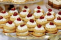 Wedding candy bar table. Cakes with cream and berries and other sweets. High quality photo