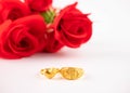 Wedding celebration on valentines day with red rose bouquet, wedding rings, isolated on white background. Concept of love and Royalty Free Stock Photo