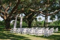 Wedding ceremony alter chairs under oak tree