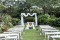 Wedding ceremony arch, altar decorated with flowers on the lawn Royalty Free Stock Photo