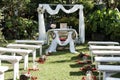 Wedding ceremony arch, altar decorated with flowers on the lawn Royalty Free Stock Photo