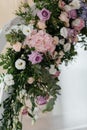 Wedding ceremony arch arrangement decoration. Closeup roses as a part of the wedding arch.