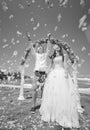 Wedding ceremony on the beach with happy honeymooners Royalty Free Stock Photo