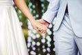 Wedding ceremony. Bride and groom standing together. Happy newlyweds hands close up. Outdoor wedding Royalty Free Stock Photo