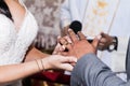 Wedding ceremony. Bride puts the engagement ring on to the groom. Wedding day Royalty Free Stock Photo