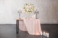 Wedding ceremony decoration. Decoration of wedding table with tender pink textile.