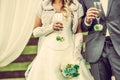 Wedding ceremony, newlywed couple with champagne glasses