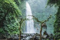 Wedding ceremony in Nung-Nung Bali waterfall in rainforest