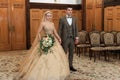 Wedding ceremony. Registry office. A newly-married couple signs the marriage document.Young couple signing wedding documents Royalty Free Stock Photo