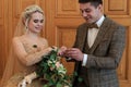 Wedding ceremony. Registry office. A newly-married couple signs the marriage document.Young couple signing wedding documents Royalty Free Stock Photo