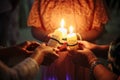 Three people hold burning candles close together Royalty Free Stock Photo