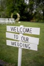 Wedding ceremony sign. Welcome to our wedding. Outside wedding decorations. Royalty Free Stock Photo