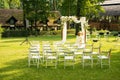 Wedding ceremony space white chairs furniture exterior design outdoor garden nature scenic view without people Royalty Free Stock Photo