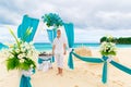 Wedding ceremony on a tropical beach in blue.The groom waits for Royalty Free Stock Photo