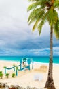 Wedding ceremony on a tropical beach in blue. Happy groom and br