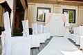 Wedding chairs with pink bows on site wedding ceremony. Royalty Free Stock Photo