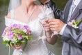 Wedding glasses in hands of groom and bride Royalty Free Stock Photo