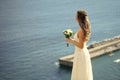 Wedding chores. Pretty girl or beautiful bride on blue sea Royalty Free Stock Photo
