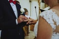 Wedding at the church, close-up of donning wedding rings Royalty Free Stock Photo