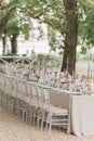 Wedding in classic style. Wedding table in natural tones with luxurious settin, bouquets of roses,