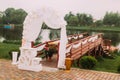 The wedding composition of the signs and arch placed near the wooeden pier. Royalty Free Stock Photo