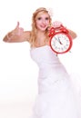 Wedding concept. Time to get married. Bride with clock. Royalty Free Stock Photo