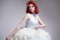 Caucasian Red-Haired Female in Tailored Wedding Dress.