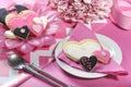 Wedding cookies on pink bridal table