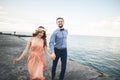 Wedding couple, bride, groom walking and posing on pier Royalty Free Stock Photo