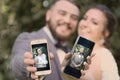 Wedding couple bride with mobiles phone close up photo