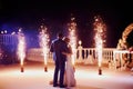 Wedding couple dancing in sparklers their first dance Royalty Free Stock Photo