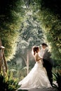 Wedding couple enjoying romantic moments outsides on a summer. Happy bride and groom on their wedding.