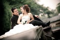 wedding couple enjoying romantic moments outsides on a summer. Happy bride and groom on their wedding.