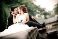 Wedding couple enjoying romantic moments outsides on a summer. Happy bride and groom on their wedding.