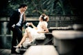 Wedding couple enjoying romantic moments outsides on a summer. Happy bride and groom on their wedding. Royalty Free Stock Photo