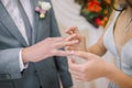 Wedding couple exchanging wedding rings. Wedding rings