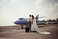 Wedding couple fly on honeymoon Royalty Free Stock Photo
