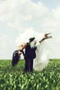 Wedding couple on green grass and blue sky Royalty Free Stock Photo