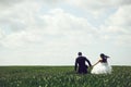 Wedding couple on green grass and blue sky Royalty Free Stock Photo