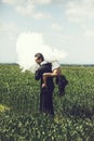 Wedding couple on green grass and blue sky Royalty Free Stock Photo