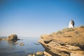 Wedding couple, groom, bride with bouquet posing near sea and blue sky Royalty Free Stock Photo